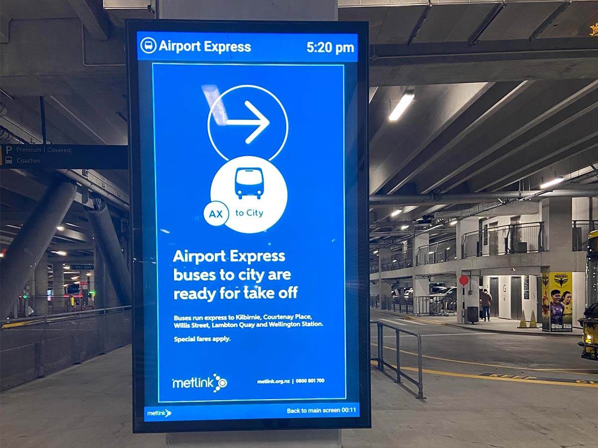 Digital screen at wellington airport showing airport express signage