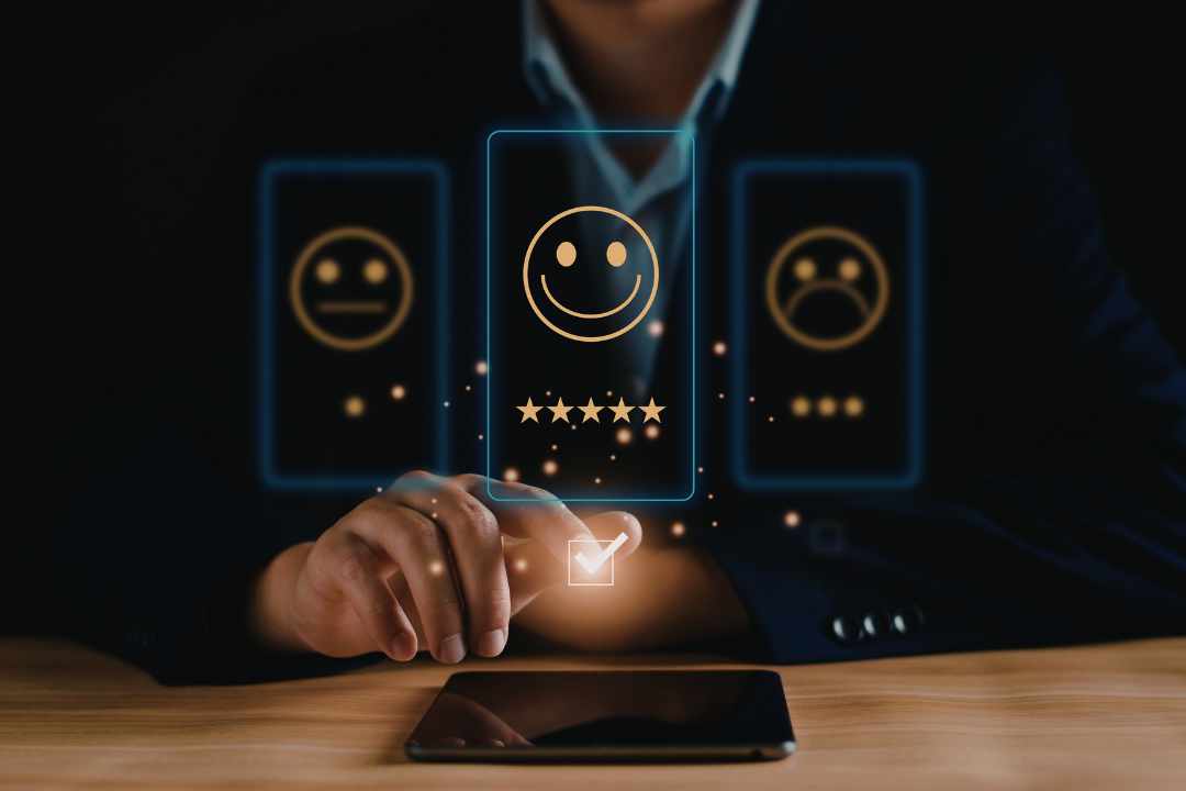 Person selecting a five star customer satisfaction rating on a tablet