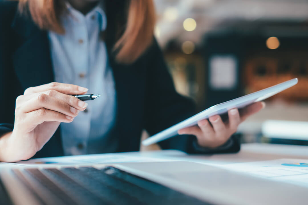 accountant holding tablet