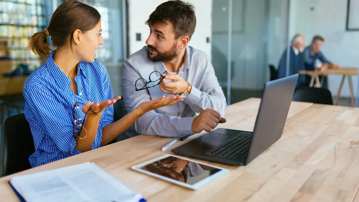two people discussing google ad mistakes