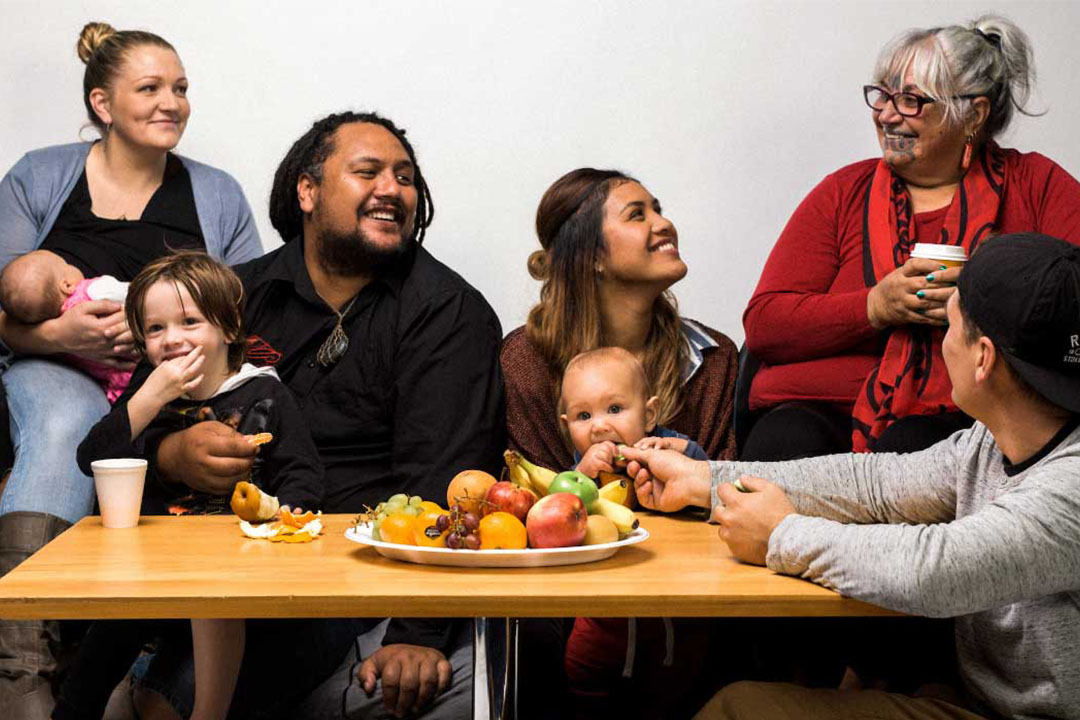 happy family sitting at table