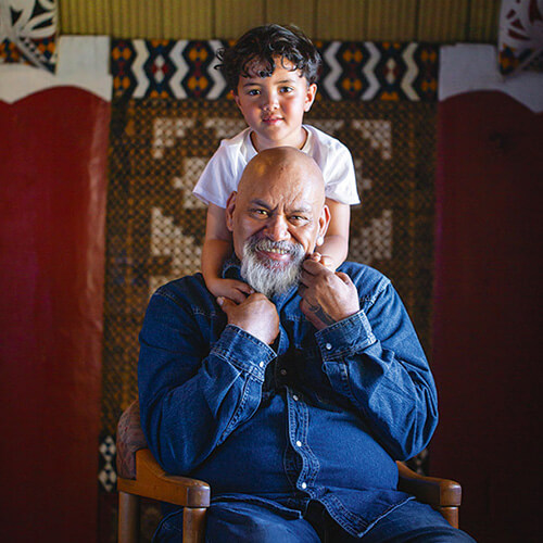 man and child portrait in a marae