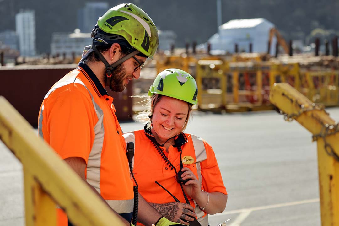 man and woman in high vis