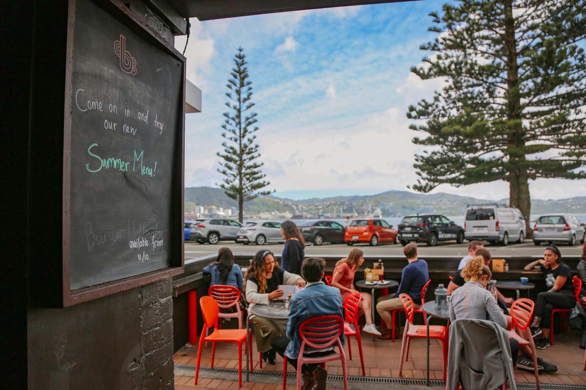 people dining in courtyard at beach babylon cafe