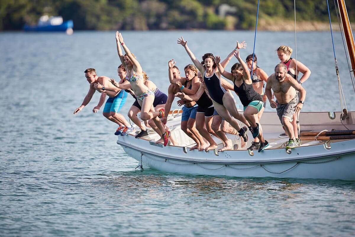 people jumping into water