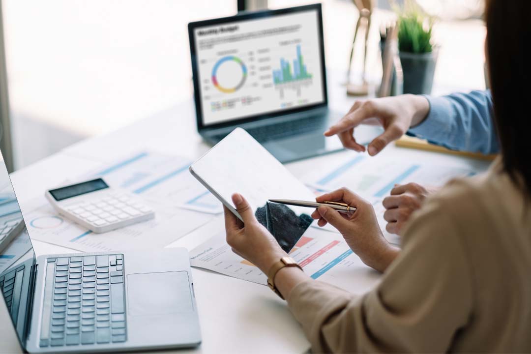 two people analysing google analytics metrics
