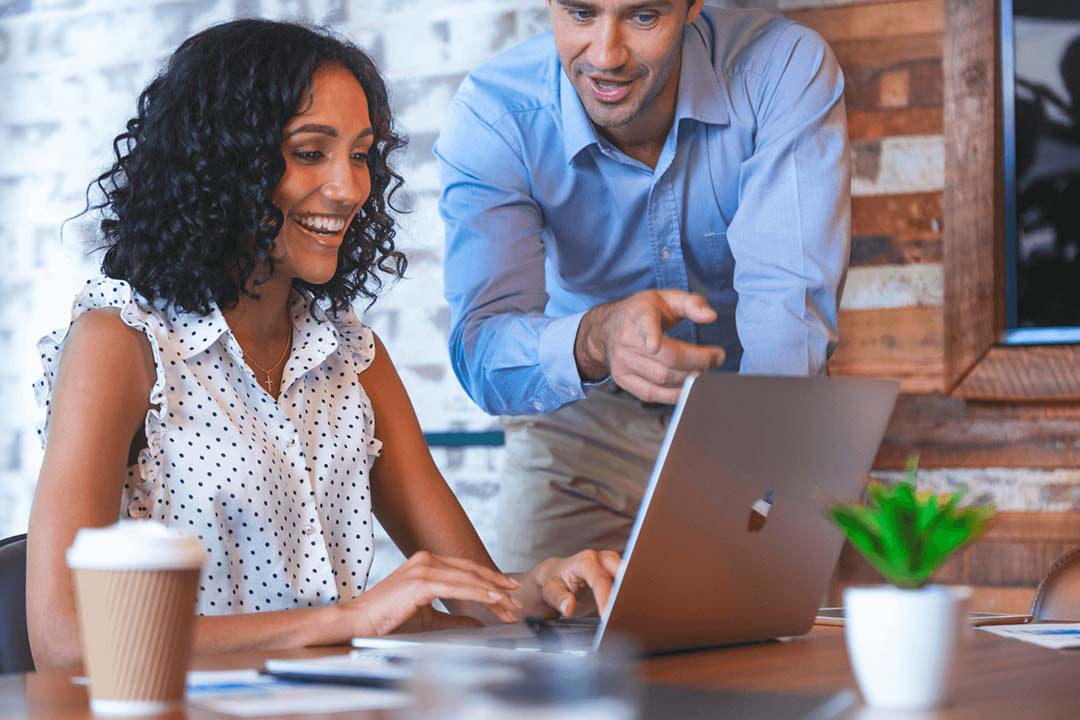 two people discussing web development project in nz