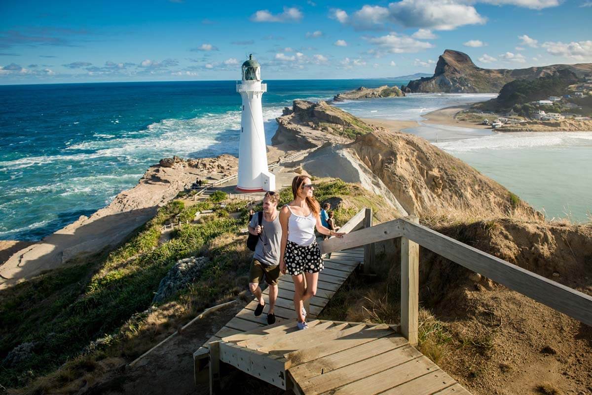two people walking up steps to the castlepoint lighthouse