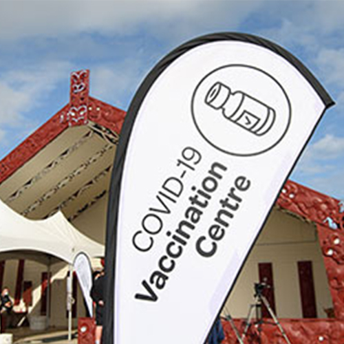 vaccination flag outside marae